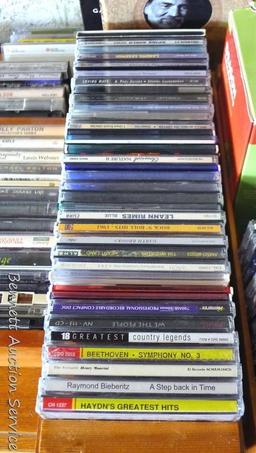 CDs and cassette tapes including nature sounds, Leann Rimes, Garth Brooks, Willie Nelson, Paul Simon