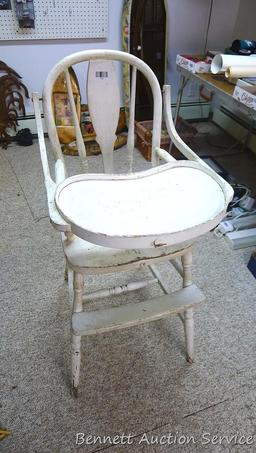 Really cool old high chair is still sturdy and in overall good condition.