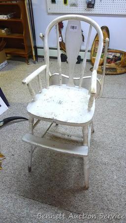 Really cool old high chair is still sturdy and in overall good condition.