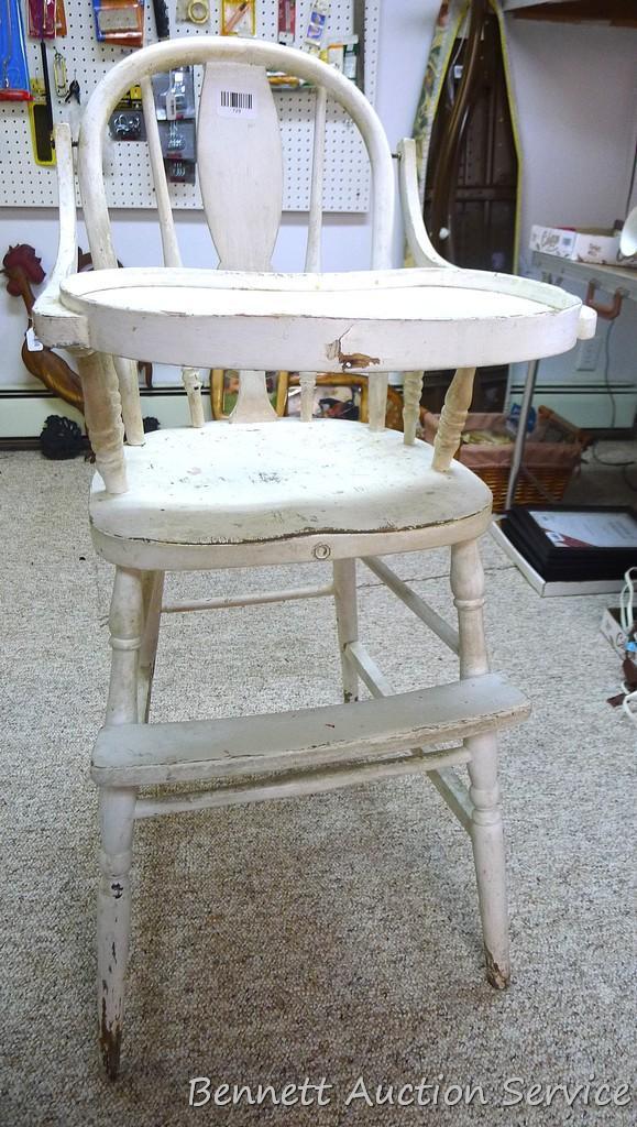Really cool old high chair is still sturdy and in overall good condition.