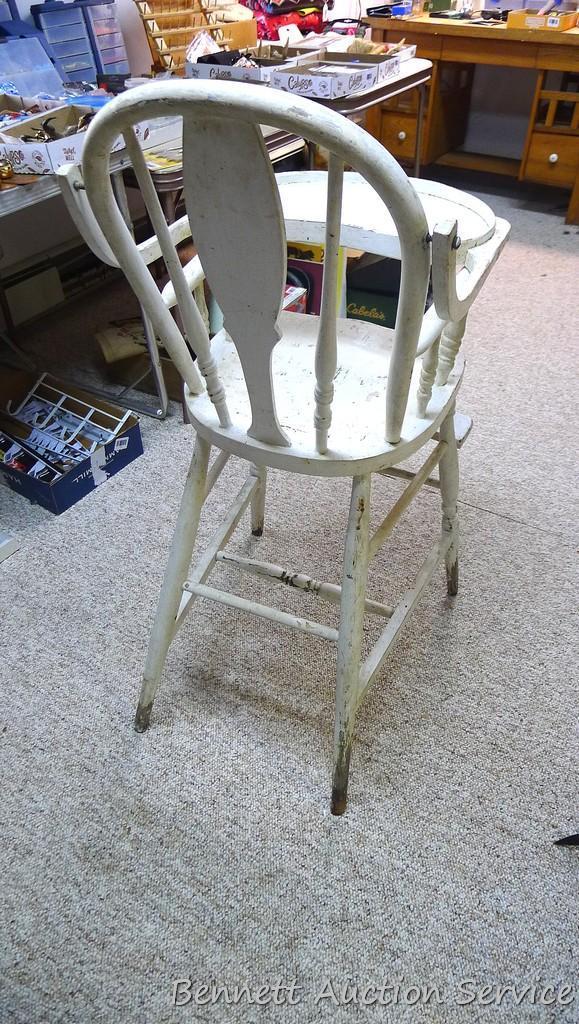 Really cool old high chair is still sturdy and in overall good condition.