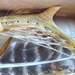 Whitetail deer antlers have been decorated with fur, feathers and leather. Each is approx. 8".