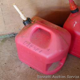 Two 5 gallon gas totes have a little liquid in bottoms. If shipped will be emptied for a fee.