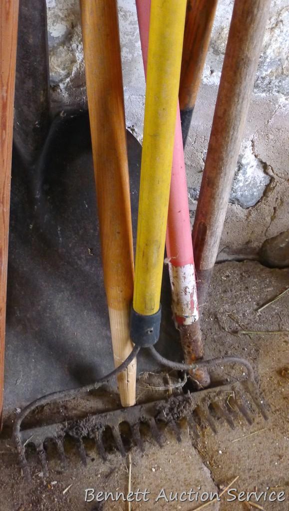 Five misc. handles; scoop shovel with wooden handle; cute 27" spade shovel; rake and more.