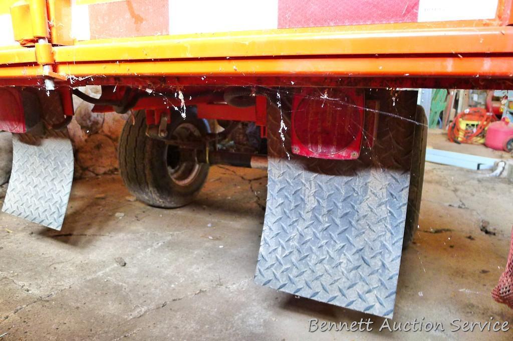Large utility trailer with hand pump hydraulic dump is of all steel construction. Box is 53" x 74" x