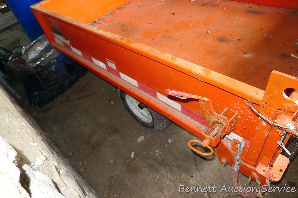Large utility trailer with hand pump hydraulic dump is of all steel construction. Box is 53" x 74" x