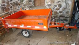 Large utility trailer with hand pump hydraulic dump is of all steel construction. Box is 53" x 74" x