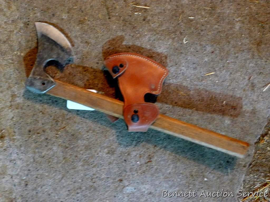 Unique hatchet is 18" long with 4" x 5-1/2" blade and leather sheath.