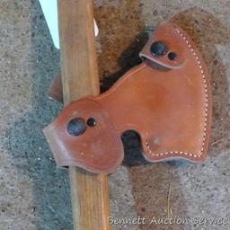 Unique hatchet is 18" long with 4" x 5-1/2" blade and leather sheath.