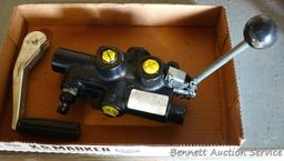 Hydraulic cylinder valve assembly; handle for a jack.