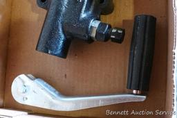 Hydraulic cylinder valve assembly; handle for a jack.