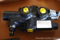 Hydraulic cylinder valve assembly; handle for a jack.