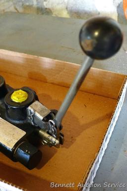 Hydraulic cylinder valve assembly; handle for a jack.