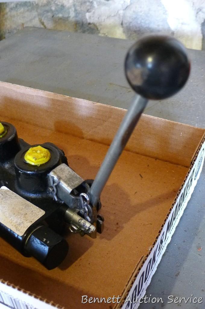 Hydraulic cylinder valve assembly; handle for a jack.