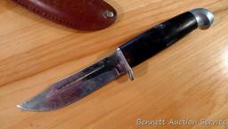 Northwest Territory knife is 8-1/2" long. Comes in leather sheath.