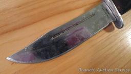 Northwest Territory knife is 8-1/2" long. Comes in leather sheath.
