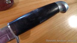 Northwest Territory knife is 8-1/2" long. Comes in leather sheath.