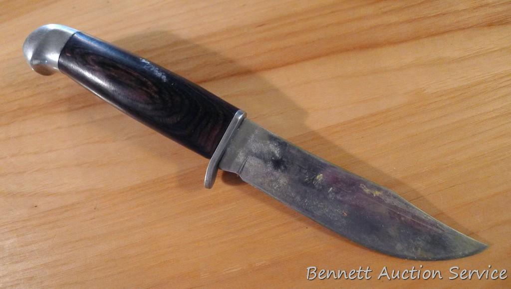 Northwest Territory knife is 8-1/2" long. Comes in leather sheath.