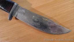 Northwest Territory knife is 8-1/2" long. Comes in leather sheath.