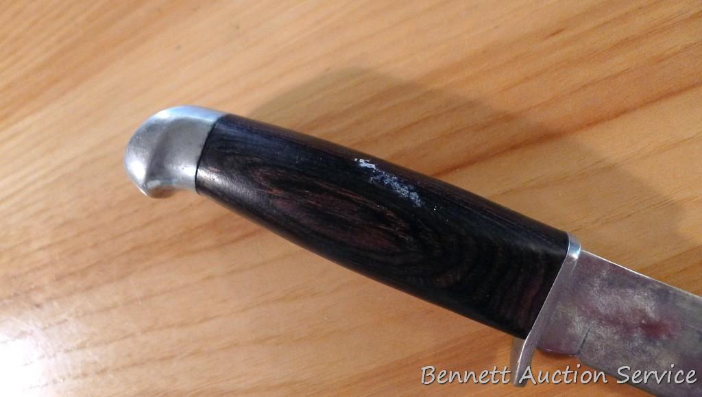Northwest Territory knife is 8-1/2" long. Comes in leather sheath.
