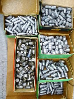 Assorted cast lead bullets including round nose, flat cone nose, Spitzer, capped base, more.