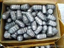 Assorted cast lead bullets including round nose, flat cone nose, Spitzer, capped base, more.