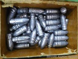 Assorted cast lead bullets including round nose, flat cone nose, Spitzer, capped base, more.