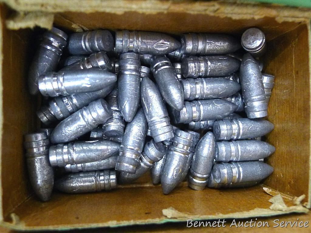 Assorted cast lead bullets including round nose, flat cone nose, Spitzer, capped base, more.