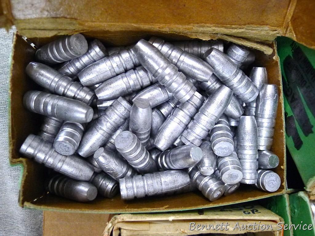 Assorted cast lead bullets including round nose, flat cone nose, Spitzer, capped base, more.
