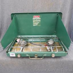 Coleman camp stove is about 21" x 13" x 4". Looks to be in pretty good condition and includes