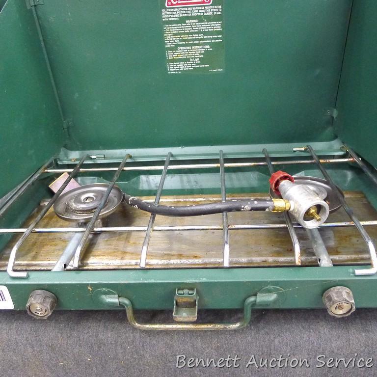 Coleman camp stove is about 21" x 13" x 4". Looks to be in pretty good condition and includes