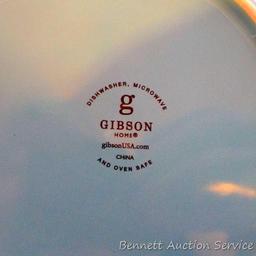 Gibson dinnerware in pretty teal and green colors. Pieces include eight 10-1/2" dinner plates, seven