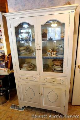 Very charming cabinet with glass doors on top, the drawers and paneled doors have a pressed design
