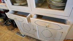 Very charming cabinet with glass doors on top, the drawers and paneled doors have a pressed design
