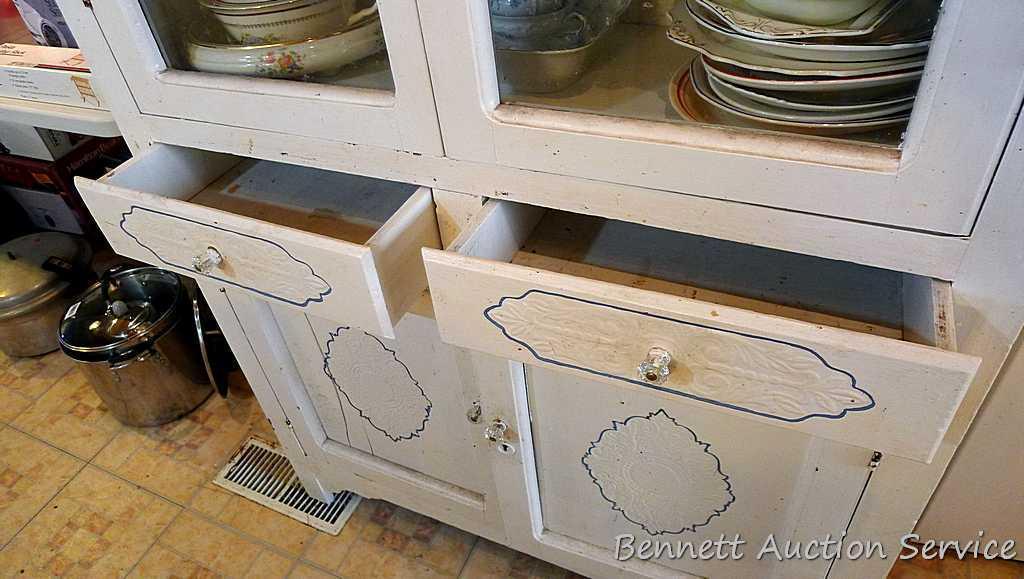 Very charming cabinet with glass doors on top, the drawers and paneled doors have a pressed design