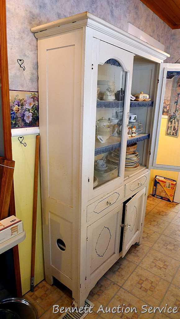 Very charming cabinet with glass doors on top, the drawers and paneled doors have a pressed design