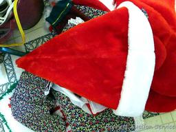 Two Christmas tree stands, larger is 24" across feet; extension cords; timer; Christmas stockings,