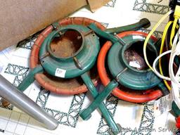 Two Christmas tree stands, larger is 24" across feet; extension cords; timer; Christmas stockings,