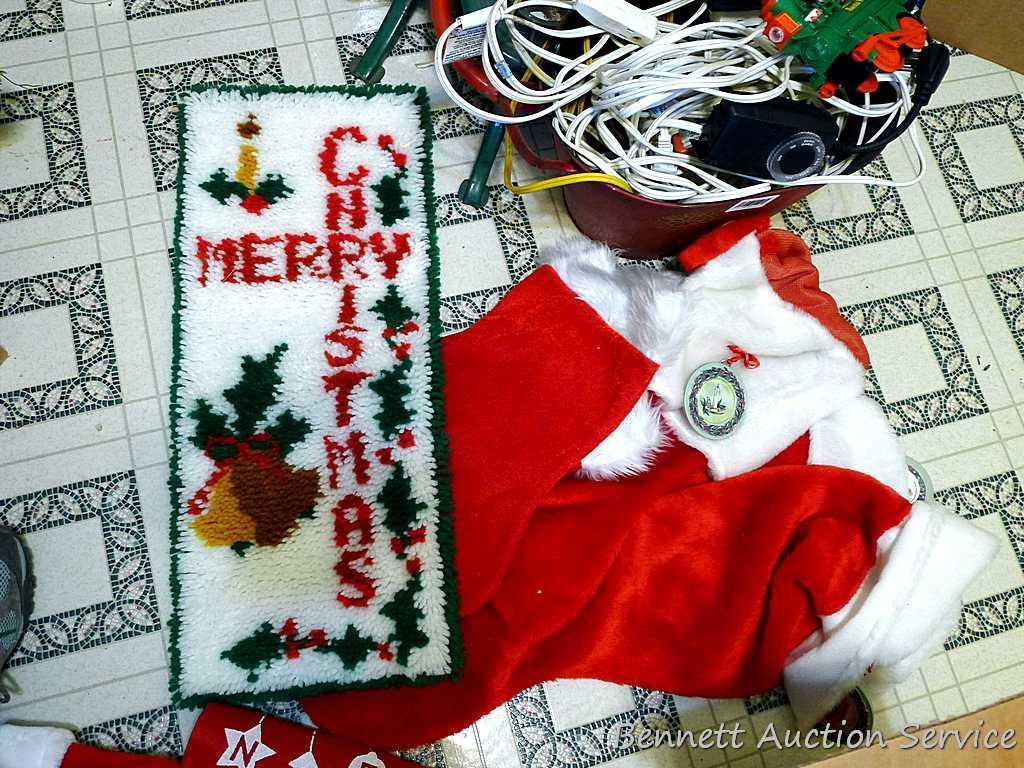 Two Christmas tree stands, larger is 24" across feet; extension cords; timer; Christmas stockings,