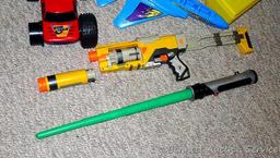 Tub of toys includes some K'Nex; Nerf rifle; set of 4 water Blasters; ceramic military dressed piggy