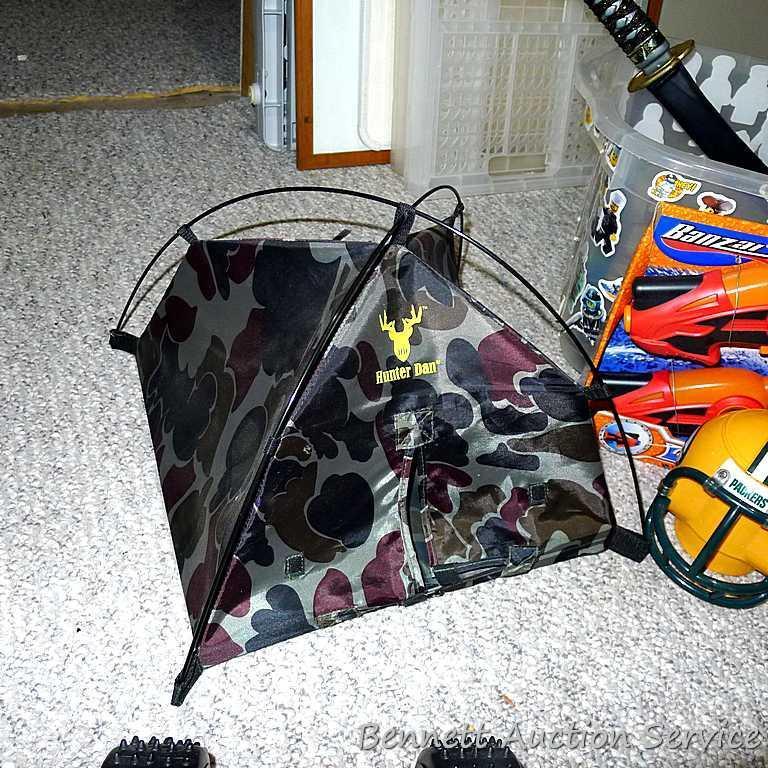 Tub of toys includes some K'Nex; Nerf rifle; set of 4 water Blasters; ceramic military dressed piggy
