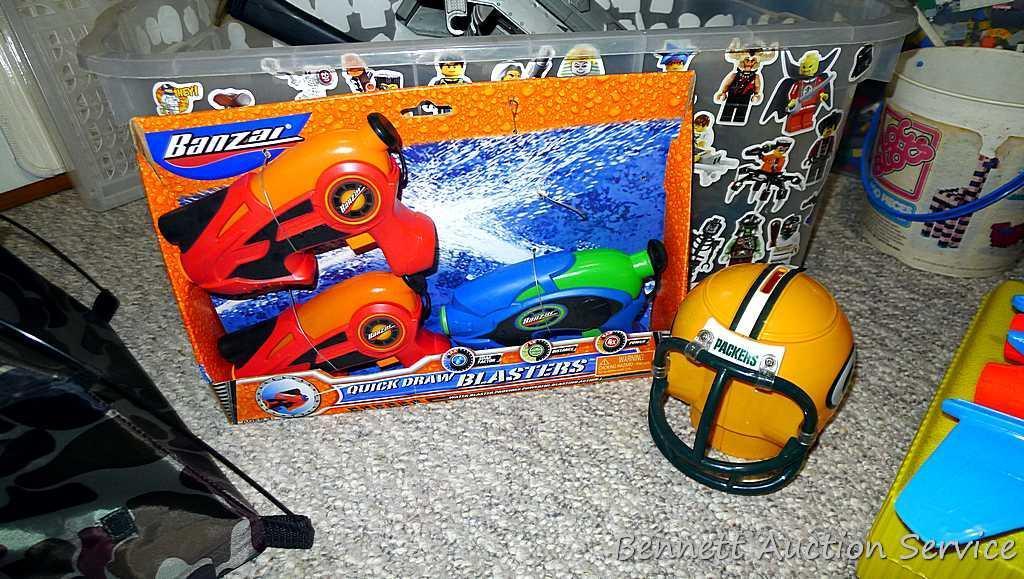 Tub of toys includes some K'Nex; Nerf rifle; set of 4 water Blasters; ceramic military dressed piggy