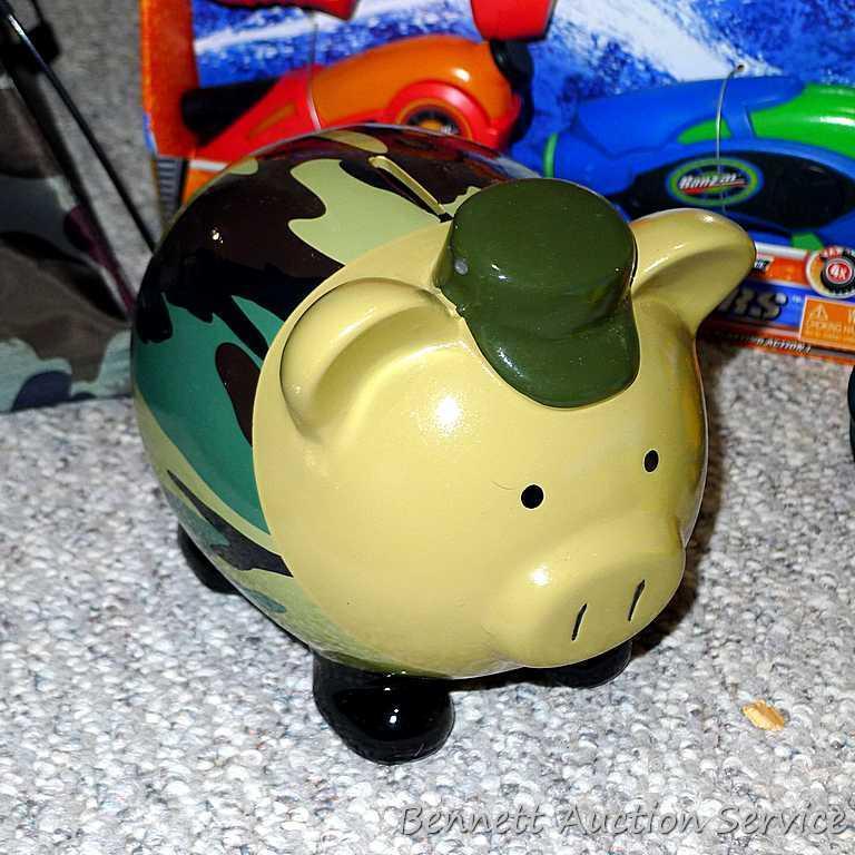 Tub of toys includes some K'Nex; Nerf rifle; set of 4 water Blasters; ceramic military dressed piggy
