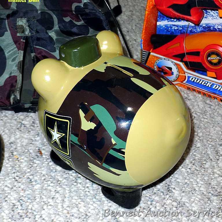 Tub of toys includes some K'Nex; Nerf rifle; set of 4 water Blasters; ceramic military dressed piggy