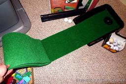 Club Champ Automatic Putting System for indoor practice and a box full of golf balls.