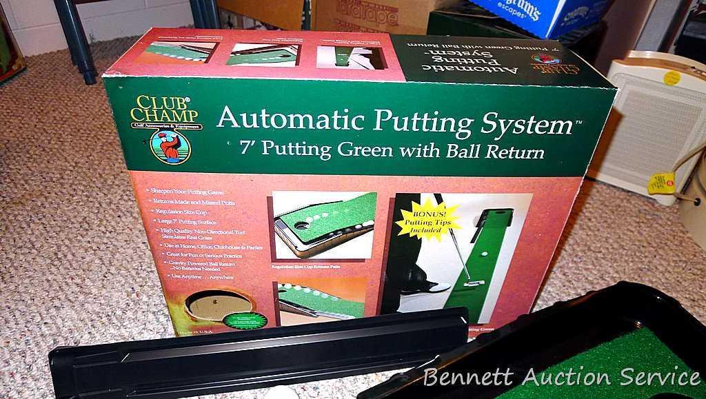 Club Champ Automatic Putting System for indoor practice and a box full of golf balls.