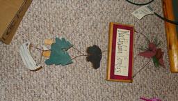 Clay standup disc of a loon made with Mt. St. Helens' Ash is 7" diameter; sturdy metal grapevine
