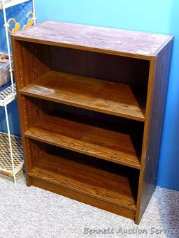 Shelving unit with 2 adjustable shelves; measures 11" x 24" x 31-1/2" tall.