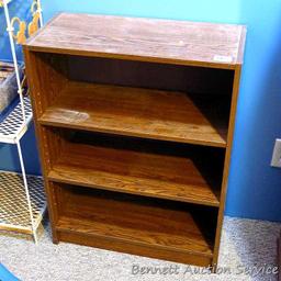 Shelving unit with 2 adjustable shelves; measures 11" x 24" x 31-1/2" tall.