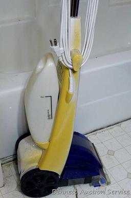 Bissell Quick Steamer Plus is 44" tall. Runs.